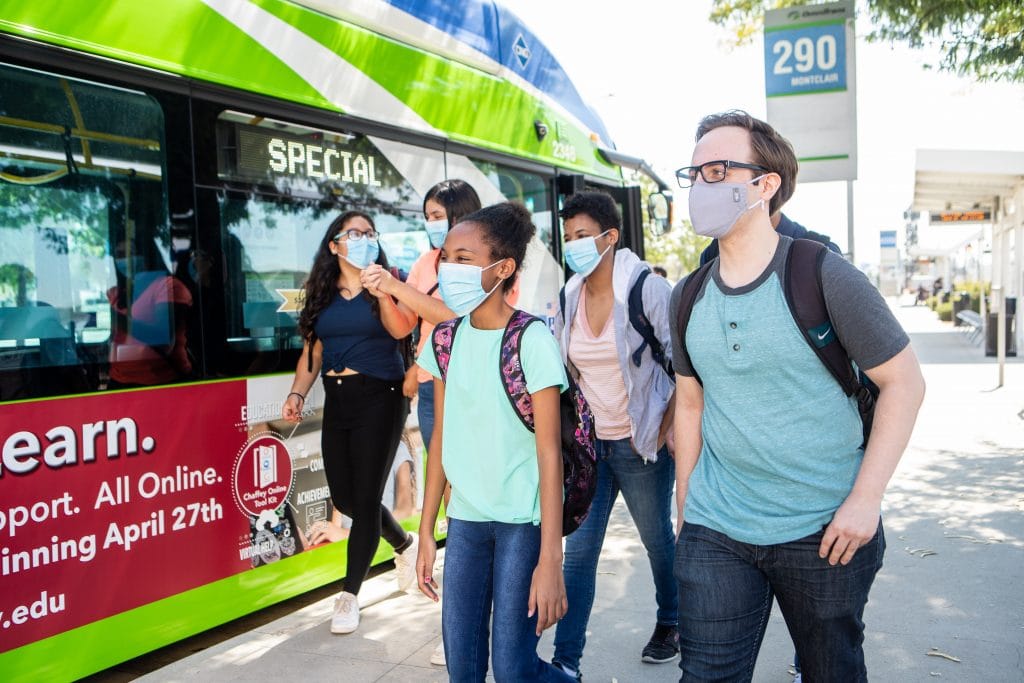 students at bus stop