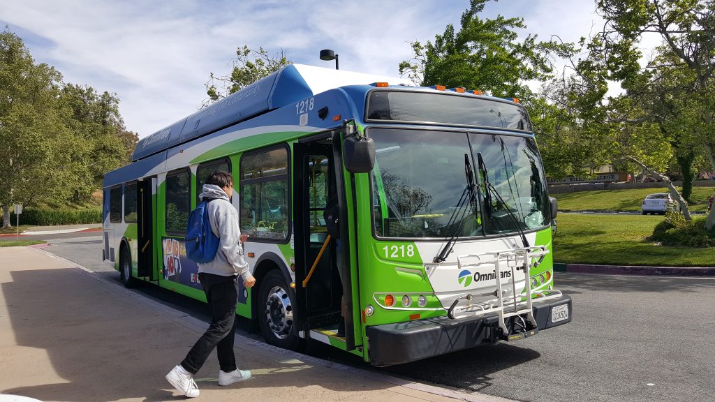 Student Walking on to Omnitrans Bus